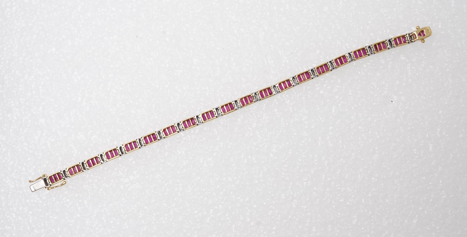 A ruby and diamond bracelet and pendant